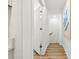 Bright hallway with modern floors leads to the stairs at 300 Cherry St, Belmont, NC 28012