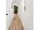 Clean white hallway with light wood floors, leading to a bedroom at 300 Cherry St, Belmont, NC 28012