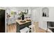 Bright kitchen with white cabinets, butcher block island, and modern appliances at 300 Cherry St, Belmont, NC 28012