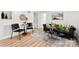 Comfortable living room with decor, black couch, rug and light wood floors at 300 Cherry St, Belmont, NC 28012