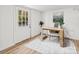 Office area with a natural wood desk and decorative rug at 300 Cherry St, Belmont, NC 28012