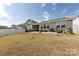 Large backyard with ample space and a partially fenced perimeter, offering privacy and room for recreation at 3100 Cheyney Park Dr, Charlotte, NC 28269