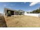 Spacious backyard featuring a screened-in porch and a white picket fence, perfect for outdoor entertaining at 3100 Cheyney Park Dr, Charlotte, NC 28269