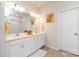 Bright bathroom featuring double vanity with white cabinets, light-colored walls and tiles, and decorative accents at 3100 Cheyney Park Dr, Charlotte, NC 28269