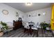 Cozy dining area with a table set for four, modern decor, and natural light creating a welcoming atmosphere at 3100 Cheyney Park Dr, Charlotte, NC 28269