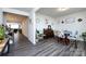 Open concept dining room with hardwood floors, elegant decor, and a seamless flow into other living spaces at 3100 Cheyney Park Dr, Charlotte, NC 28269