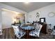 Open dining room with stylish floral chairs, a hardwood floor, and natural light, great for Gathering meals at 3100 Cheyney Park Dr, Charlotte, NC 28269