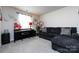 Comfortable living room with a cozy sectional sofa, piano, and bright natural light at 3100 Cheyney Park Dr, Charlotte, NC 28269