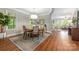 Inviting dining room featuring hardwood floors, a round table, and stylish decor at 3201 Oak Brook Dr, Waxhaw, NC 28173