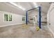 Spacious garage with a car lift and ample workspace at 3201 Oak Brook Dr, Waxhaw, NC 28173