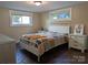 Bright bedroom featuring a white metal bed frame, light walls, and two large windows at 351 Glenwood Dr, Mooresville, NC 28115