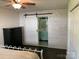 Bedroom with a modern barn door entrance to the bathroom and a stylish vanity at 351 Glenwood Dr, Mooresville, NC 28115