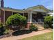 Beautiful brick home with a welcoming front porch, decorative columns, and well-maintained landscaping at 351 Glenwood Dr, Mooresville, NC 28115