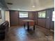 Spacious finished basement area featuring a foosball table, concrete floors, and wood trim at 351 Glenwood Dr, Mooresville, NC 28115