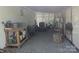 Well-organized garage with a variety of tools and equipment neatly arranged on shelving and a gravel floor at 351 Glenwood Dr, Mooresville, NC 28115