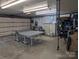 Spacious garage interior with ping pong table, storage shelves, and ample space for hobbies at 351 Glenwood Dr, Mooresville, NC 28115