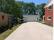 Long driveway leading up to a detached garage, with ample parking space and well-kept grounds at 351 Glenwood Dr, Mooresville, NC 28115