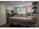 Updated kitchen with stainless steel appliances, granite countertops, and hardwood floors, offering ample storage at 351 Glenwood Dr, Mooresville, NC 28115