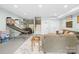 Finished basement features neutral walls, recessed lighting, a sofa, and access to the staircase to the main floor at 401 Yorkfield Dr, Shelby, NC 28150