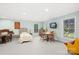 This large basement features a piano, sitting area, and windows providing natural light at 401 Yorkfield Dr, Shelby, NC 28150