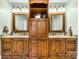 Bathroom featuring double sinks with granite countertops and matching wood cabinetry at 401 Yorkfield Dr, Shelby, NC 28150