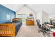 Bedroom with blue accent wall, wooden bed frame, large window, and desk setup at 401 Yorkfield Dr, Shelby, NC 28150