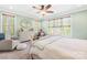 Bright bedroom with a ceiling fan, dresser, and large windows offering natural light at 401 Yorkfield Dr, Shelby, NC 28150