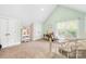 Spacious bedroom featuring a vanity, desk area, neutral carpet, and large windows at 401 Yorkfield Dr, Shelby, NC 28150