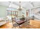 Dining room with coffered ceilings, hardwood floors, a large window, and a wood table at 401 Yorkfield Dr, Shelby, NC 28150