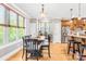 Open dining area featuring hardwood floors, modern lighting and views of the kitchen at 401 Yorkfield Dr, Shelby, NC 28150