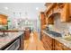 Spacious kitchen featuring wooden cabinetry, granite countertops, and stainless steel appliances at 401 Yorkfield Dr, Shelby, NC 28150