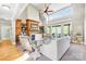 Living room featuring vaulted ceilings, a fireplace, built-in shelves, and ample natural light at 401 Yorkfield Dr, Shelby, NC 28150