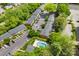 Community aerial featuring a pool, parking, and lush landscaping at 4605 Hedgemore Dr # I, Charlotte, NC 28209