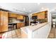 Well-lit kitchen with wooden cabinets, stainless steel appliances, and stylish countertops at 4605 Hedgemore Dr # I, Charlotte, NC 28209