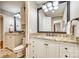Bright bathroom featuring granite countertops, white cabinets, large mirror, and decorative lighting at 4607 Hedgemore Dr # H, Charlotte, NC 28209