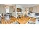 Open-concept living area with hardwood floors, modern furnishings, and seamless flow to the dining space at 4607 Hedgemore Dr # H, Charlotte, NC 28209