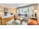 Inviting living room with stylish furniture, hardwood floors, and large windows for natural light at 4607 Hedgemore Dr # H, Charlotte, NC 28209