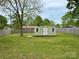 A spacious backyard features a storage shed surrounded by lush green grass at 4623 Monmouth Dr, Charlotte, NC 28269