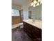 Well-lit bathroom featuring a modern vanity, accessible shower, and updated fixtures at 4623 Monmouth Dr, Charlotte, NC 28269