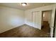 This carpeted bedroom has a closet, fresh paint, and a view to the hallway at 4623 Monmouth Dr, Charlotte, NC 28269
