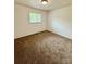 This carpeted bedroom has a window and neutral paint at 4623 Monmouth Dr, Charlotte, NC 28269