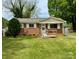 Charming brick home with a well-maintained front yard and classic white trim at 4623 Monmouth Dr, Charlotte, NC 28269