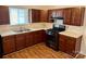 Updated kitchen with wood cabinets, a double sink, and modern appliances at 4623 Monmouth Dr, Charlotte, NC 28269