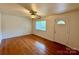 Inviting living room featuring hardwood floors and a large window for natural light at 4623 Monmouth Dr, Charlotte, NC 28269