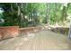 Spacious wooden back deck surrounded by trees is ideal for outdoor enjoyment at 4704 Beech Crest Pl, Charlotte, NC 28269