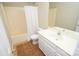 Cozy bathroom with tiled floor, white vanity, bath and shower combo with curtain at 4704 Beech Crest Pl, Charlotte, NC 28269