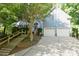 Charming two-story home featuring a two-car garage and landscaped front yard with mature trees at 4704 Beech Crest Pl, Charlotte, NC 28269