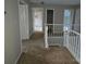 Upstairs hallway showing access to rooms and the staircase to the main floor at 4704 Beech Crest Pl, Charlotte, NC 28269