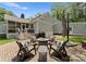 Charming backyard with a brick patio, comfortable seating, and a cozy fire pit, ideal for outdoor gatherings at 4931 Pine Ridge Rd, Charlotte, NC 28226