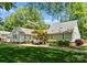 Expansive backyard featuring lush green grass, mature trees and healthy landscape at 4931 Pine Ridge Rd, Charlotte, NC 28226